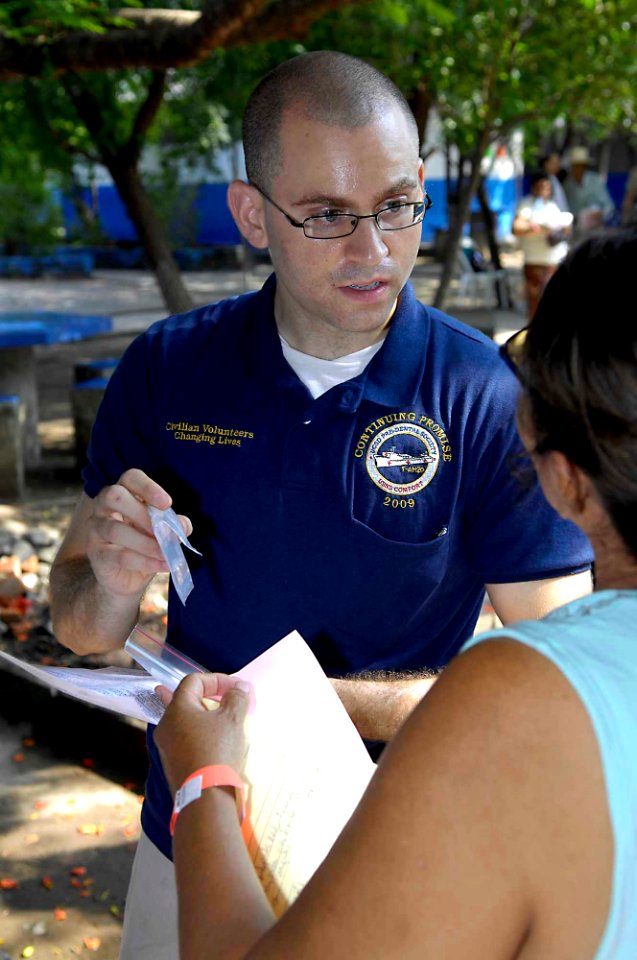 US Navy 090627-F-7923S-062 Nicholas Berry administers medications from the pharmacy at Centro Escular Ramon Mendoza school during a Continuing Promise 2009 medical community service project