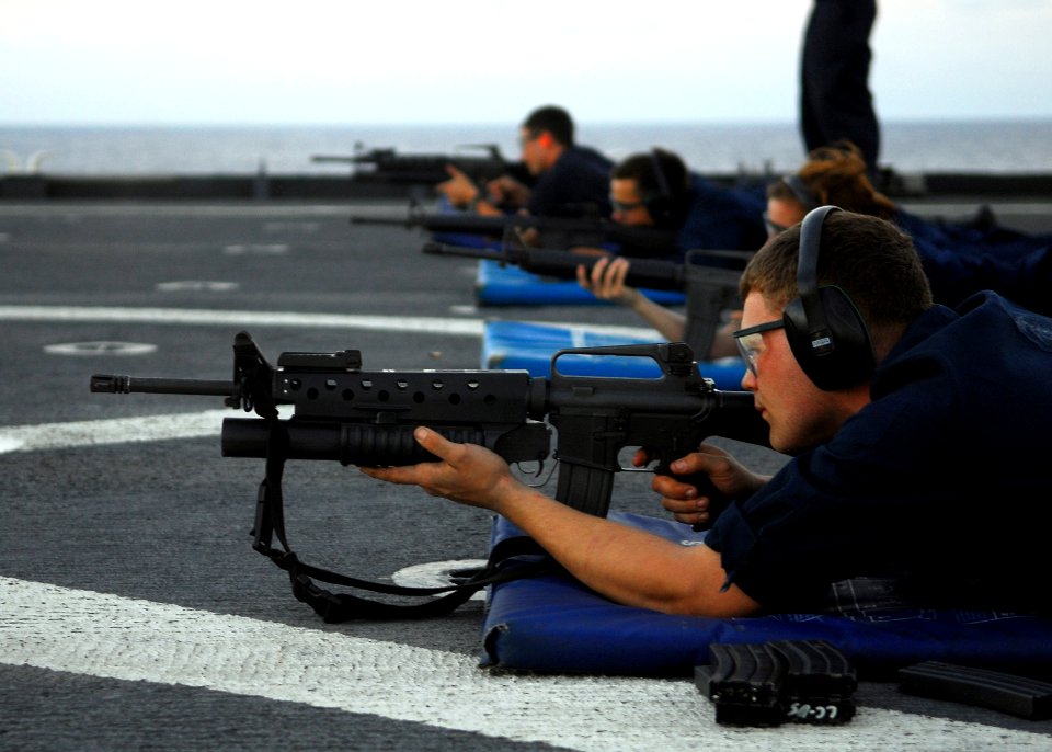 US Navy 090625-N-6692A-028 Sailors participate in an M-16 service rifle qualification exercise aboard the amphibious dock landing ship USS Tortuga (LSD 46)