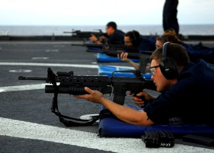 US Navy 090625-N-6692A-028 Sailors participate in an M-16 service rifle qualification exercise aboard the amphibious dock landing ship USS Tortuga (LSD 46) photo