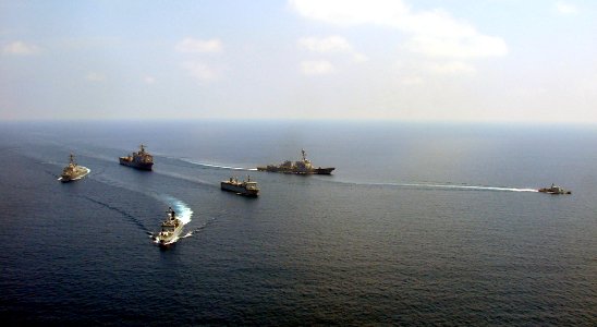 US Navy 090627-N-3999B-472 The Royal Malaysian Navy multi-role support ship KD Sri Indera Sakti, corvette KD Lekir and patrol vessel KD Handalan maneuver in formation with the amphibious dock landing ship USS Harpers Ferry (LSD