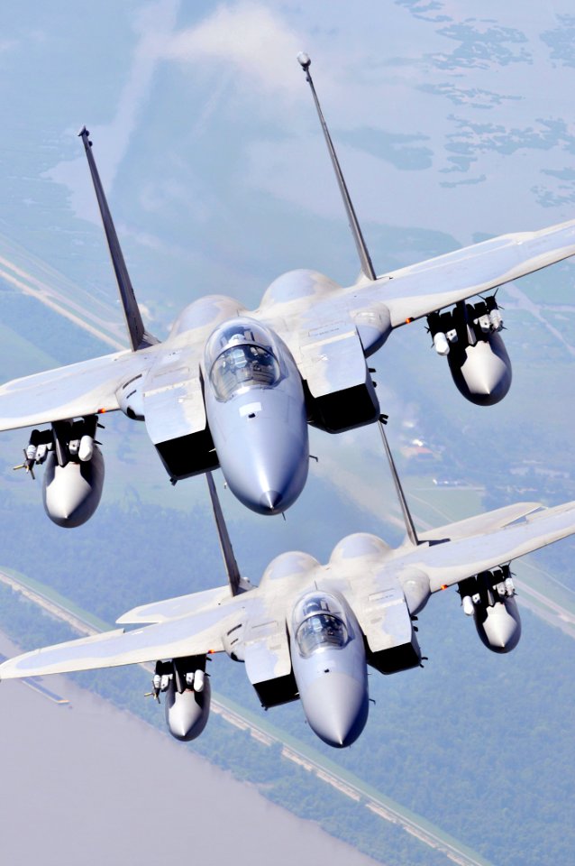 US Navy 090711-N-9712C-012 Two F-15 Strike Eagles assigned to the Louisiana Air National Guard 159th Fighter Wing fly over southern Louisiana's wetlands during a photo exercise