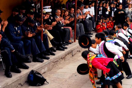 US Navy 090710-N-7092S-491 Students from Escuela General Basica Centenario take a bow to Sailors from guided-missile frigate USS Kauffman (FFG 59) after performing a native folk dance during a community relations project in Ari