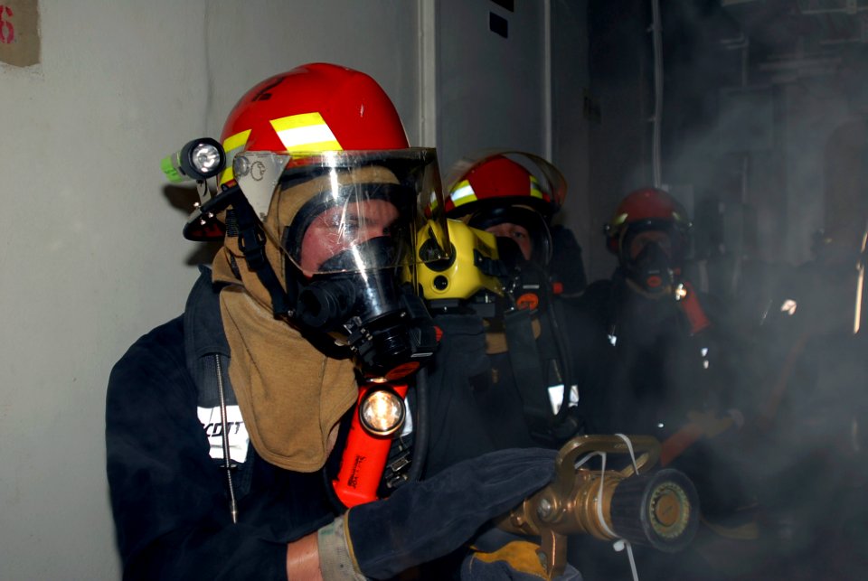 US Navy 090710-A-8397T-009 Damage Controlman Fireman Apprentice James Battaglia and Sailors aboard the amphibious dock landing ship USS Oak Hill (LSD 51)