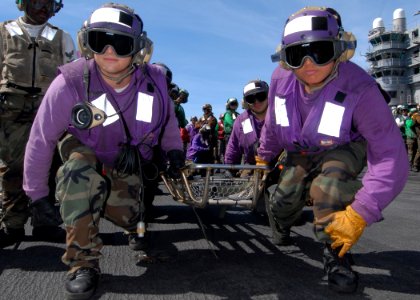US Navy 090712-N-6720T-032 Air department Sailors practice proper stretcher lifting techniques during a mass casualty drill on the flight deck aboard USS George Washington (CVN 73)