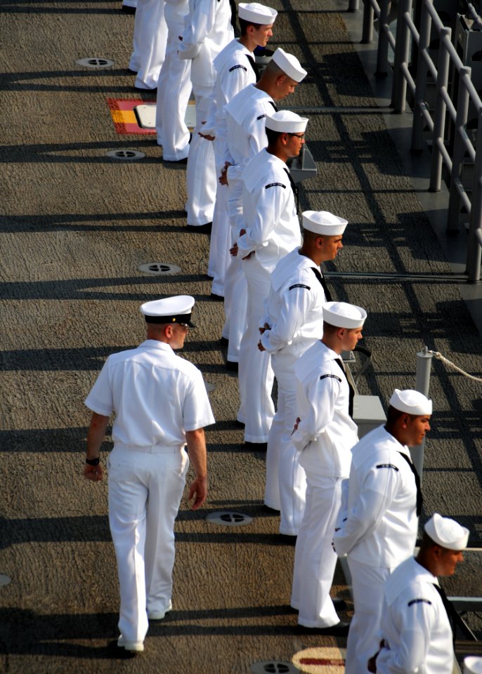 US Navy 090710-N-0860R-016 Chief Aviation Boatswain's Mate - Handling (AW-SW) Wade Keller walks behind Sailors from USS Makin Island's (LHD 8) AIMD and Air departments man the rails