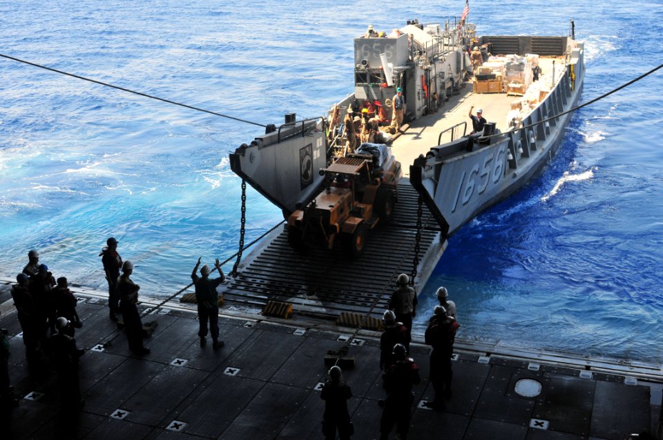 US Navy 090711-N-9740S-454 A landing craft utility (LCU), attached to Assault Craft Unit (ACU) 2, prepares to unload mail and supplies into the well-deck of the of the multi-purpose amphibious assault ship USS Bataan (LHD 5)