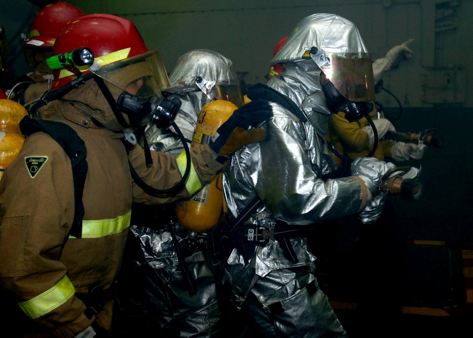 US Navy 090713-N-2013O-019 Sailors fight a simulated fire during a general quarters drill aboard the aircraft carrier USS George Washington (CVN 73)
