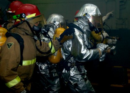 US Navy 090713-N-2013O-019 Sailors fight a simulated fire during a general quarters drill aboard the aircraft carrier USS George Washington (CVN 73)