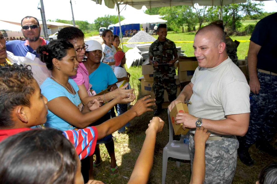US Navy 090712-F-7923S-018 Staff Sgt. Fernando Cuba, a satellite system operator aboard the Military Sealift Command hospital ship USNS Comfort (T-AH 20), hands out various medical ointments and other products to patients