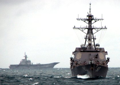 US Navy 090713-N-7058E-068 The guided-missile destroyer USS Chafee (DDG 90) leads the Royal Thai Navy aircraft carrier HTMS Chakri Naruebet (CVH 911) during the at-sea phase of Cooperation Afloat Readiness and Training (CARAT)