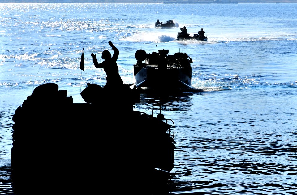 US Navy 090711-N-9740S-444 Amphibious assault vehicles from the 22nd Marine Expeditionary Unit (22nd MEU) approach the well deck of the amphibious assault ship USS Bataan (LHD 5) during an amphibious training exercise