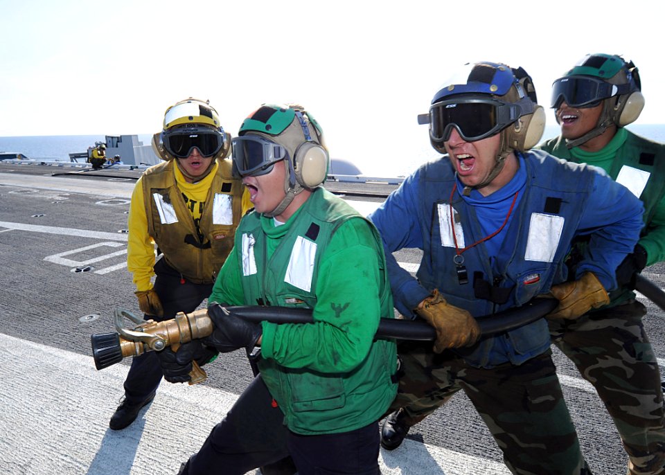 US Navy 090713-N-1062H-027 Sailors fights a simulated fire during a general quarters drill on the flight deck of the USS George Washington (CVN 73)