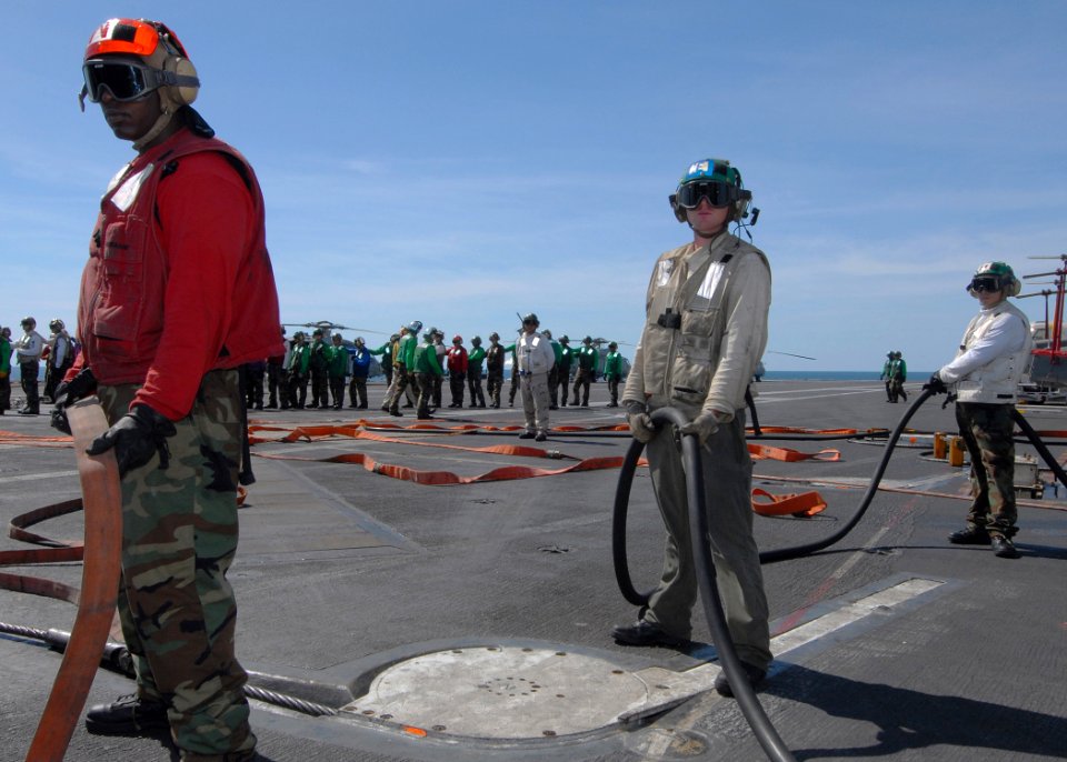 US Navy 090712-N-6720T-040 The aircraft carrier USS George Washington (CVN 73) and Carrier Air Wing (CVW) 5 Sailors man fire hoses during a mass casualty drill on the flight deck