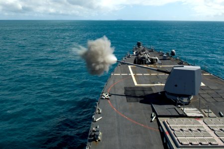 US Navy 090714-N-9123L-146 The guided-missile destroyer USS McCampbell (DDG 85) fires the MK 45 five-inch gun system during a naval surface fire support exercise at a training area off the coast of Australia