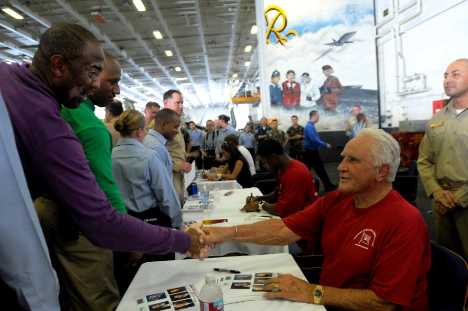 US Navy 090713-N-4995K-116 Former NFL coach Don Shula shakes hands with Chief Aviation Boatswain's Mate (Fuel) Allan Thomas in hangar bay two aboard the aircraft carrier USS Ronald Reagan (CVN 76)