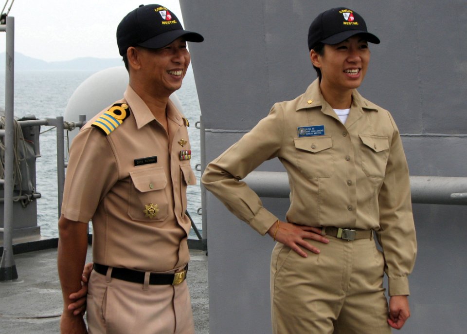 US Navy 090713-N-7058E-035 Capt. Chiya Patanun of the Royal Thai Navy's judge advocate general corps and Lt. Cmdr. Elysia Ng, staff judge advocate for Commander, Logistics Group Western Pacific, observe maneuvers aboard the doc