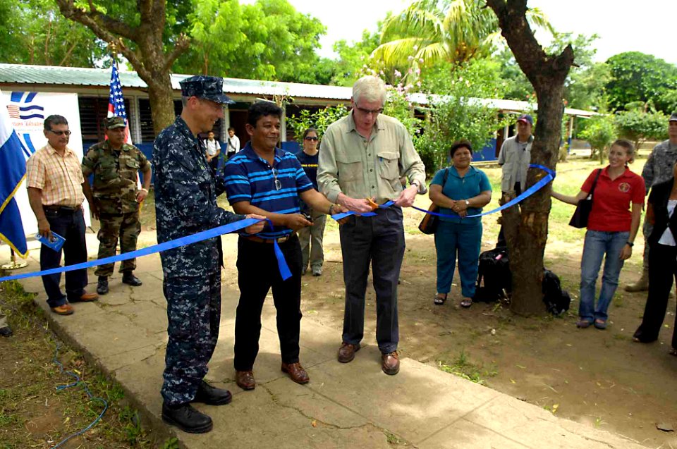 US Navy 090713-F-7923S-224 Capt. Thomas M. Negus, Continuing Promise 2009 mission commander, left, the Mayor of Villanueva, and U.S. Ambassador to Nicaragua Robert J. Callahan, cut the ribbon at Villanueva School
