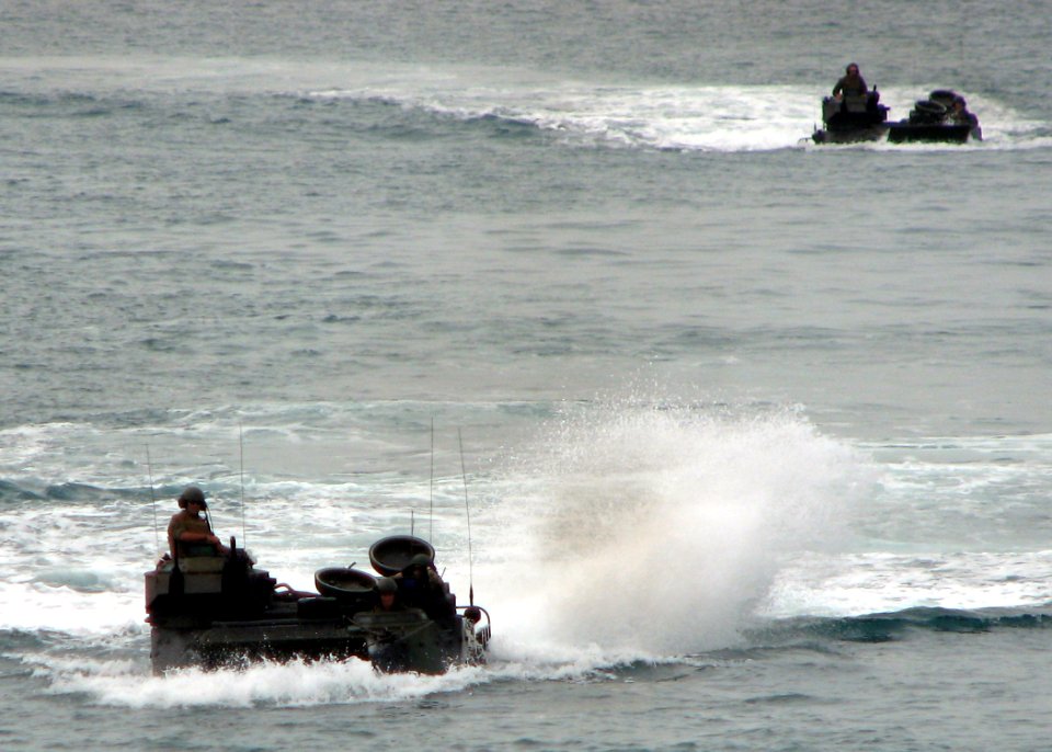 US Navy 090714-N-7058E-081 U.S. Marine Corps amphibious assault vehicles approach the well deck of the dock landing ship USS Harpers Ferry (LSD 49) after a combined amphibious landing exercise