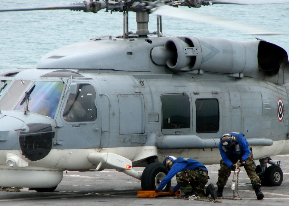 US Navy 090714-N-7058E-022 Members of the flight deck crew aboard the dock landing ship USS Harpers Ferry (LSD 49) prepare a Royal Thai Navy S-70B helicopter for takeoff