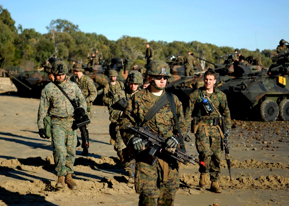 US Navy 090715-N-9520G-106 Marines assigned to the 31st Marine Expeditionary Unit (MEU) deployed aboard the amphibious assault ship USS Essex (LHD 2) move out on patrol during a training exercise at Freshwater Bay in support of