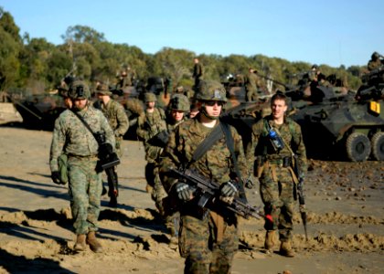 US Navy 090715-N-9520G-106 Marines assigned to the 31st Marine Expeditionary Unit (MEU) deployed aboard the amphibious assault ship USS Essex (LHD 2) move out on patrol during a training exercise at Freshwater Bay in support of