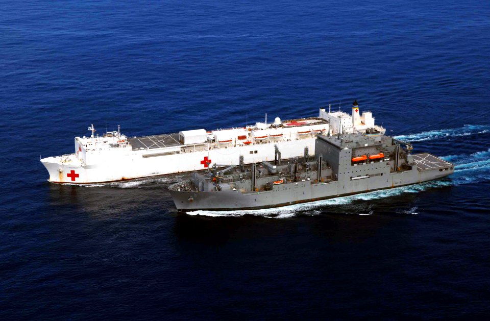 US Navy 090716-F-7923S-280 The Military Sealift Command hospital ship USNS Comfort (T-AH 20) receives supplies during an underway replenishment with the dry cargo-ammunition ship USNS Robert E. Peary (T-AKE 5)