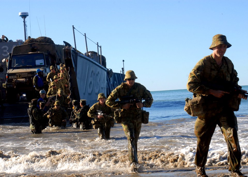 US Navy 090715-N-6692A-110 Members of an Australian Army forward support battalion unit disembark from U.S. Navy Landing Craft Utility (LCU) 1634