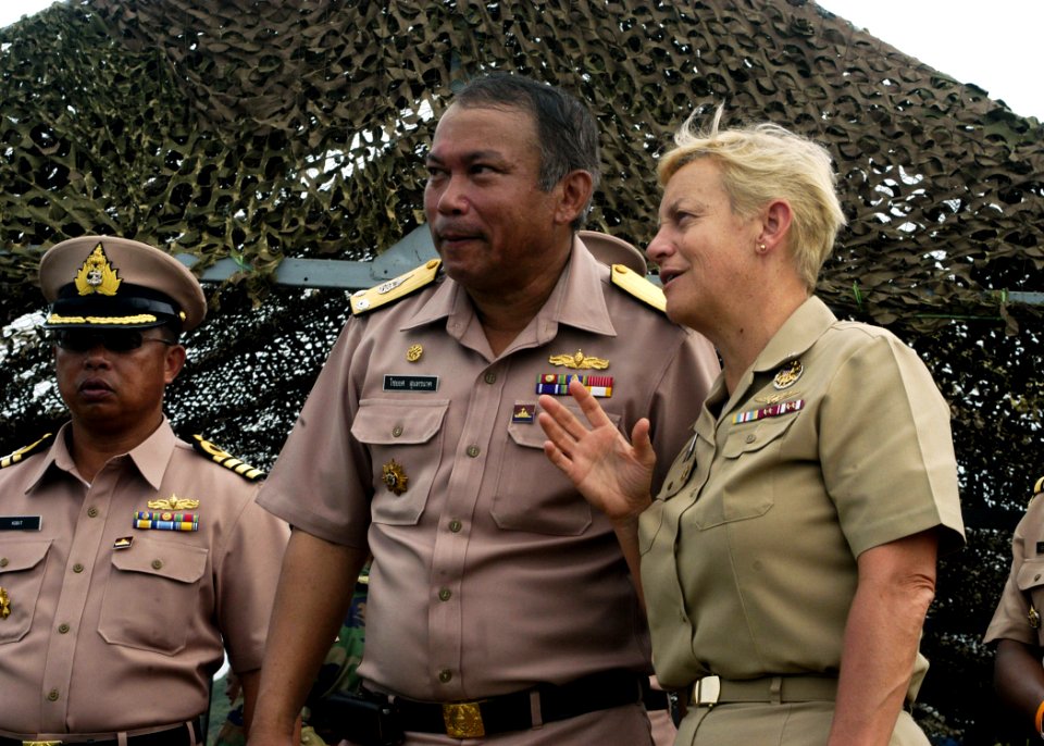 US Navy 090715-N-7783B-235 Rear Adm. Nora Tyson, Commander, Logistics Group Western Pacific, and Royal Thai Navy Rear Adm. Chaiyot Sundaranaga, Commander, Frigate Squadron 2, watch and discuss a combined amphibious landing exer