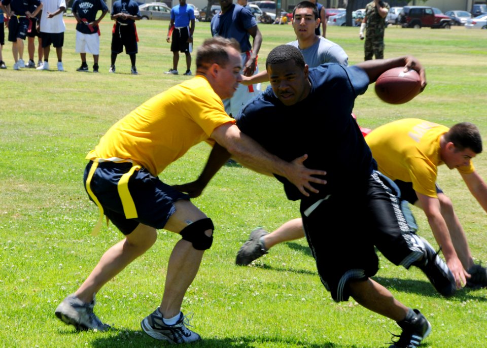 US Navy 090714-N-1424C-321 Seabees assigned to Amphibious Construction Battalion (ACB) 1 participate in the annual Captains Cup flag football competition