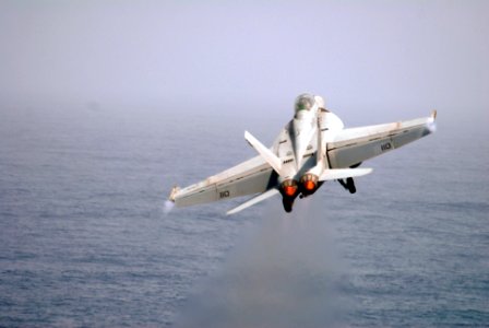 US Navy 090714-N-9132C-014 An F-A-18F Super Hornet assigned to the Fighting Redcocks of Strike fighter Squadron (VFA) 22, launches from the aircraft carrier USS Ronald Reagan (CVN 76)