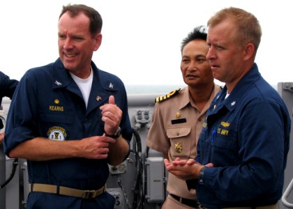 US Navy 090713-N-7058E-048 Commodore William Kearns III, Commander, Task Group 73.5, observes maneuvers with Royal Thai Navy Capt. Rassadang Teranet and Cmdr. Ed Thompson, commanding officer of the dock landing ship USS Harpers
