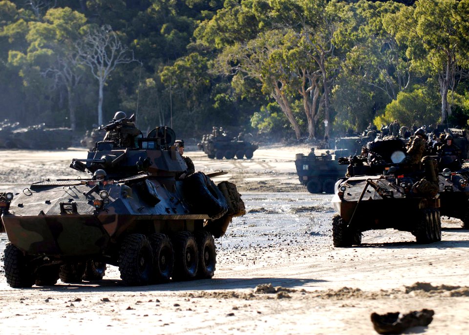 US Navy 090715-N-9520G-127 Marines assigned to the 31st Marine Expeditionary Unit (31st MEU) deployed aboard the amphibious assault ship USS Essex (LHD 2), move out on patrol in light armored vehicles