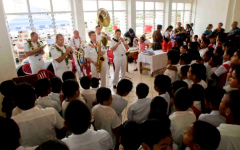 US Navy 090714-N-9689V-006 The Pacific Fleet Band performs for primary school students during the an opening ceremony for the Pacific Partnership 2009 arrival in Tonga