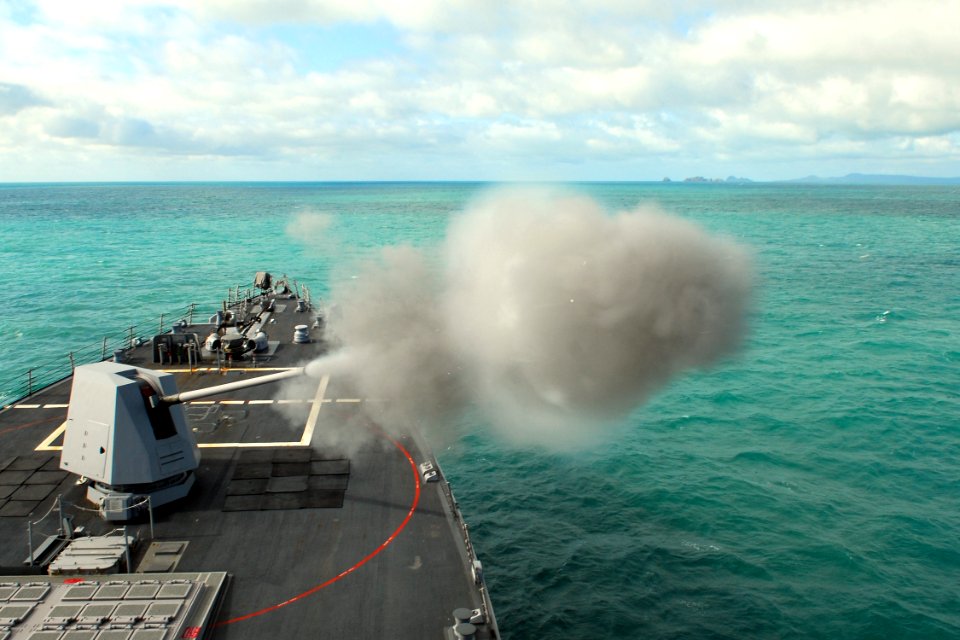 US Navy 090714-N-9123L-001 The guided-missile destroyer USS McCampbell (DDG 85) fires the MK 45 five-inch gun system during a naval surface fire support exercise at a training area off the coast of Australia