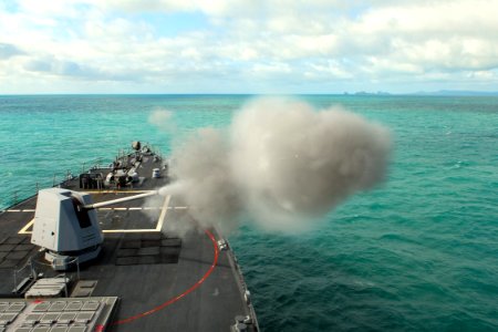 US Navy 090714-N-9123L-001 The guided-missile destroyer USS McCampbell (DDG 85) fires the MK 45 five-inch gun system during a naval surface fire support exercise at a training area off the coast of Australia