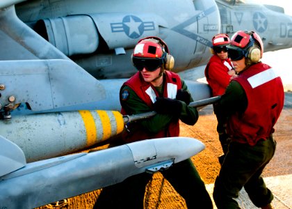 US Navy 090715-N-4010S-106 Marines assigned to Marine Attack Squadron (VMA) 211 load ordnance on an AV-8B Harrier in preparation for amphibious operations during Talisman Saber 2009