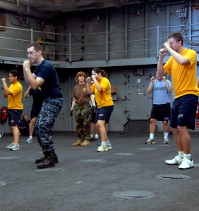 US Navy 090716-A-7779L-358 Sailors aboard USS Oak Hill (LSD 51) stand in the defensive position during the defensive tactics training. Oak Hill is participating in a combined multinational exercise Southern Partnership Station