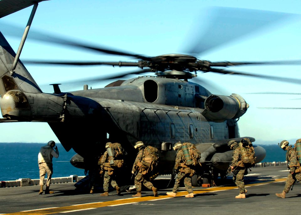 US Navy 090716-N-9520G-046 Marines assigned to the 31st Marine Expeditionary Unit (31st MEU) embarked aboard the amphibious assault ship USS Essex (LHD 2) board a CH-53E Sea Stallion helicopter during a Talisman Saber 2009 exer