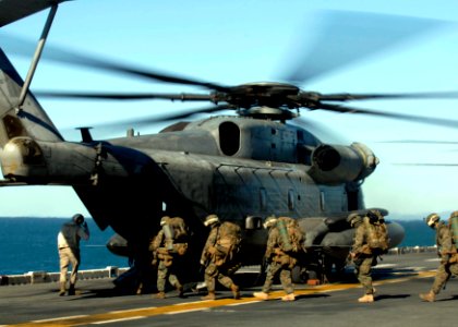 US Navy 090716-N-9520G-046 Marines assigned to the 31st Marine Expeditionary Unit (31st MEU) embarked aboard the amphibious assault ship USS Essex (LHD 2) board a CH-53E Sea Stallion helicopter during a Talisman Saber 2009 exer photo