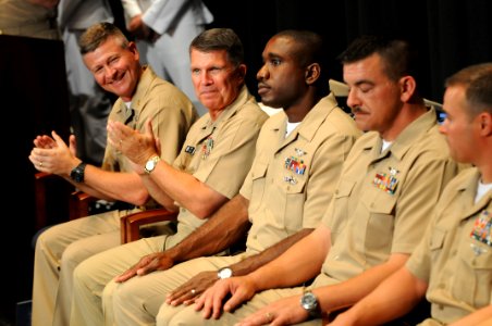US Navy 090716-N-9818V-230 Master Chief Petty Officer of the Navy (MCPON) Rick West and Rear Adm. Robert Burt, Chief of Navy Chaplains, applauds the 2009 Sailors of the Year during a promotion ceremony at the Navy Memorial