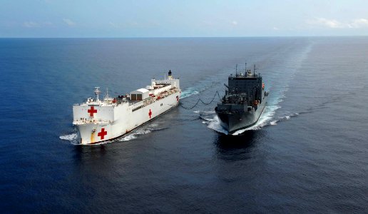 US Navy 090716-F-7923S-424 The Military Sealift Cpommand hospital ship USNS Comfort (T-AH 20) receives supplies during an underway replenishment with the dry cargo-ammunition ship USNS Robert E. Peary (T-AKE 5)