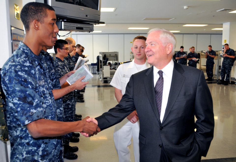 US Navy 090717-N-8848T-171 Secretary of Defense (SECDEF) the Honorable Robert M. Gates, right, shakes hands with Seaman Recruit Christopher Lambert, 19, from Detroit, in a berthing compartment of the USS Marvin Shields recruit