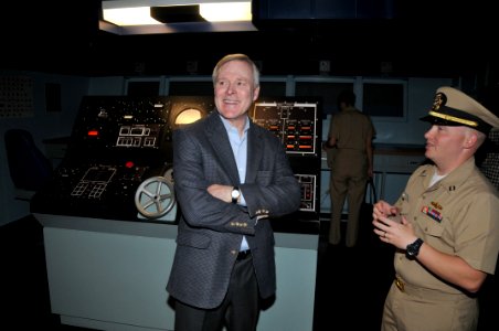 US Navy 090716-N-8848T-450 Secretary of the Navy (SECNAV) the Honorable Ray Mabus, left, shares a laugh with Lt. Greg Page, on the bridge of the battle stations training simulator USS Trayer (BST 21)
