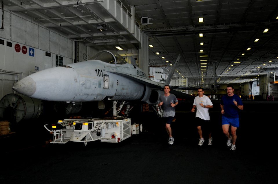 US Navy 090718-N-7456N-004 Sailorsrun laps in in the hangar bay of Carl Vinson to stay in shape while the ship is underway