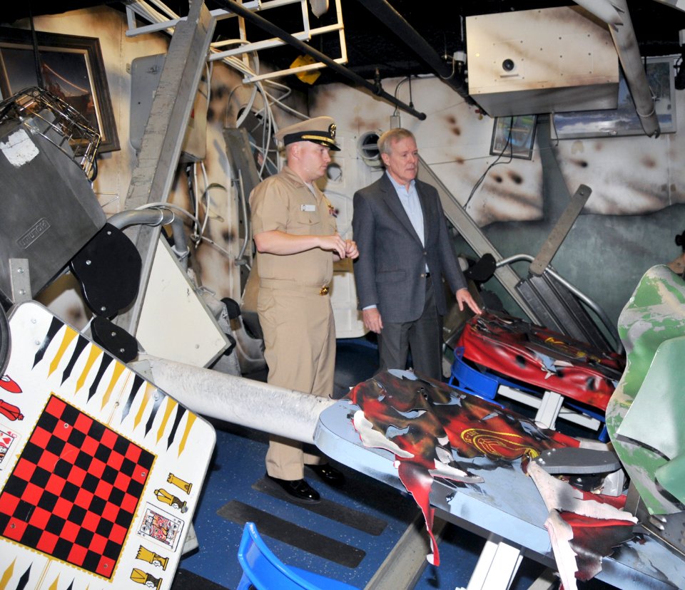 US Navy 090716-N-8848T-456 Secretary of the Navy (SECNAV) the Honorable Ray Mabus, right, tours a bomb damaged berthing compartment aboard the battle stations training simulator USS Trayer (BST 21) while visiting Recruit Traini