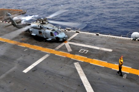 US Navy 090716-N-9740S-025 An MH-60S Sea Hawk helicopter from Helicopter Sea Combat Squadron (HSC) 22 takes off from the amphibious assault ship USS Bataan (LHD 5) photo