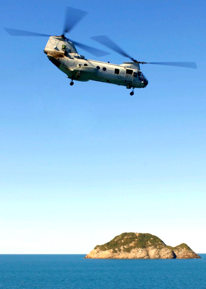 US Navy 090716-N-9950J-366 A CH-46E Sea Knight helicopter turns away shortly after lift-off from Essex during a mock amphibious assault as part of exercise Talisman Saber 2009