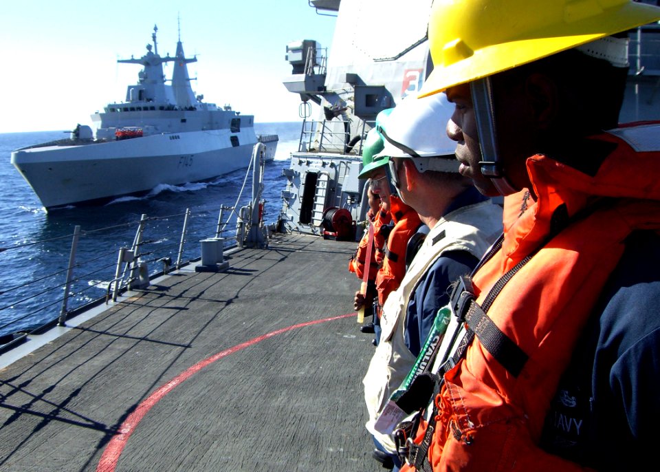 US Navy 090717-N-1655H-228 Boatswain's Mate 2nd Class Ronnie Graham stands by as the South African Navy frigate SAS Amatola (F 145) comes alongside the guided-missile destroyer USS Arleigh Burke (DDG 51)