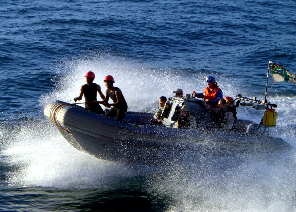 US Navy 090717-N-1655H-287 Members of the visit, board, search and seizure team of the guided-missile destroyer USS Arleigh Burke (DDG 51) transit from the South African Navy frigate SAS Amatola (F 145) after spending the day o