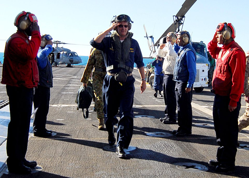 US Navy 090717-N-5538K-271 Rear Adm. Richard B. Landolt passes through rainbow sideboys on the flight deck of the amphibious transport dock ship USS Denver (LPD 9)